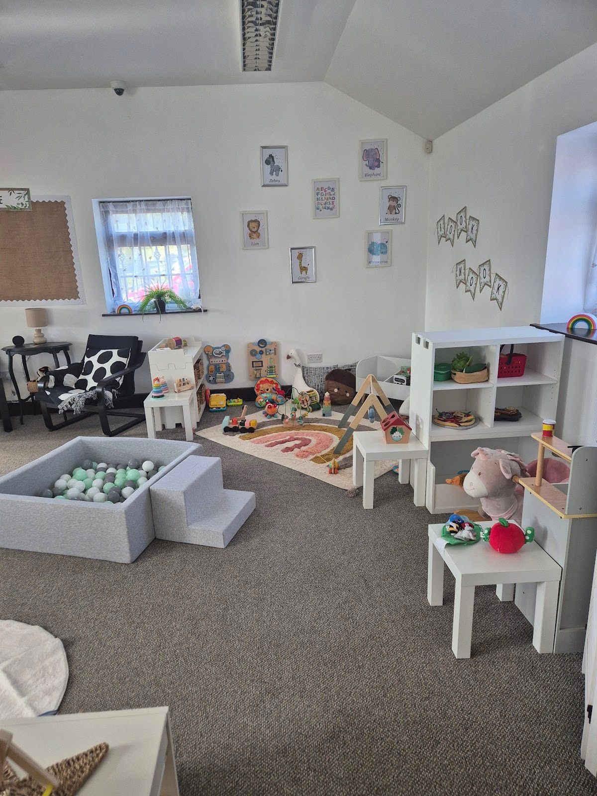 Ball pit and low shelving in The Baby Barn playroom