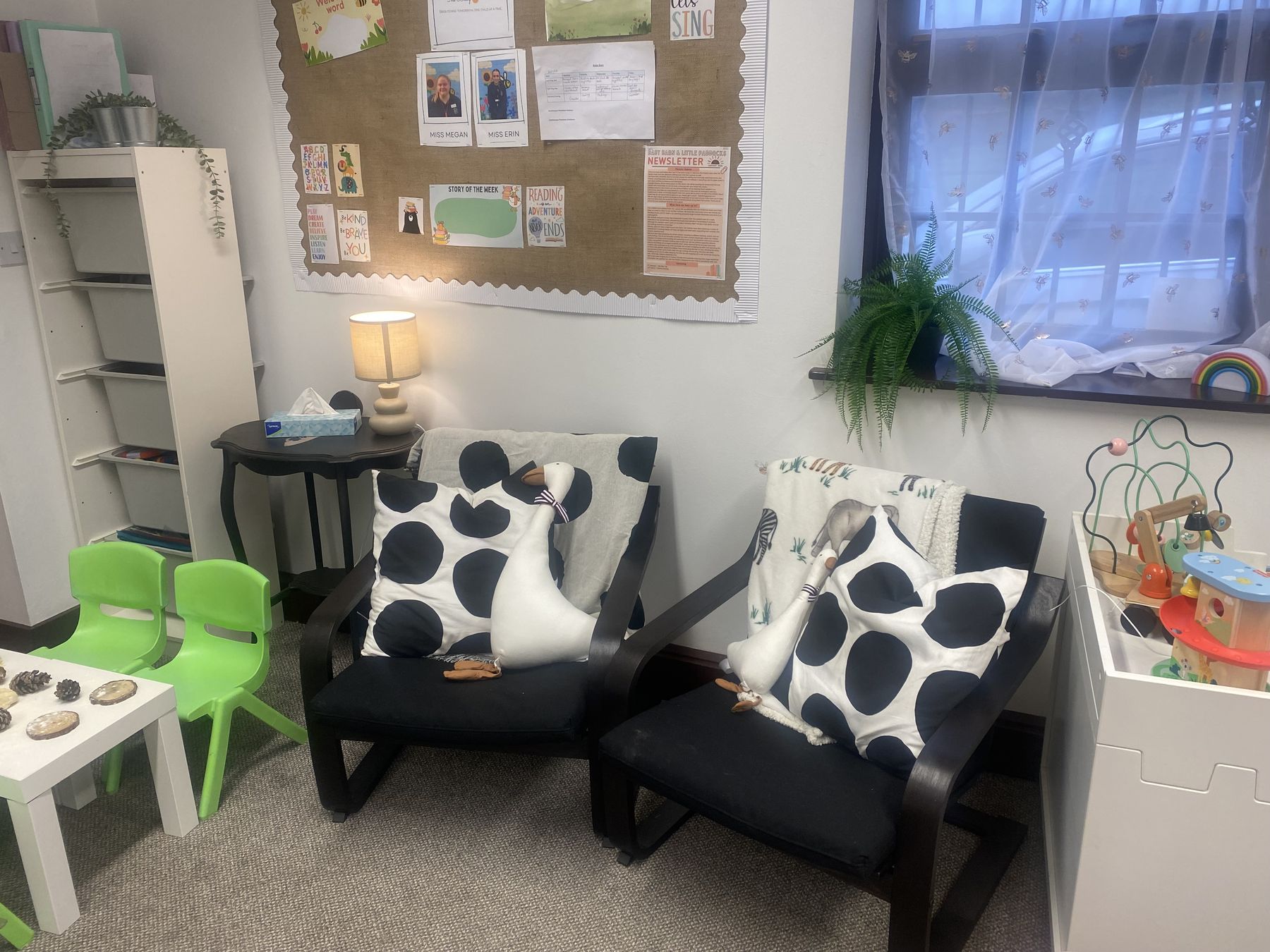 Cosy seating corner in The Baby Barn with soft lamp light