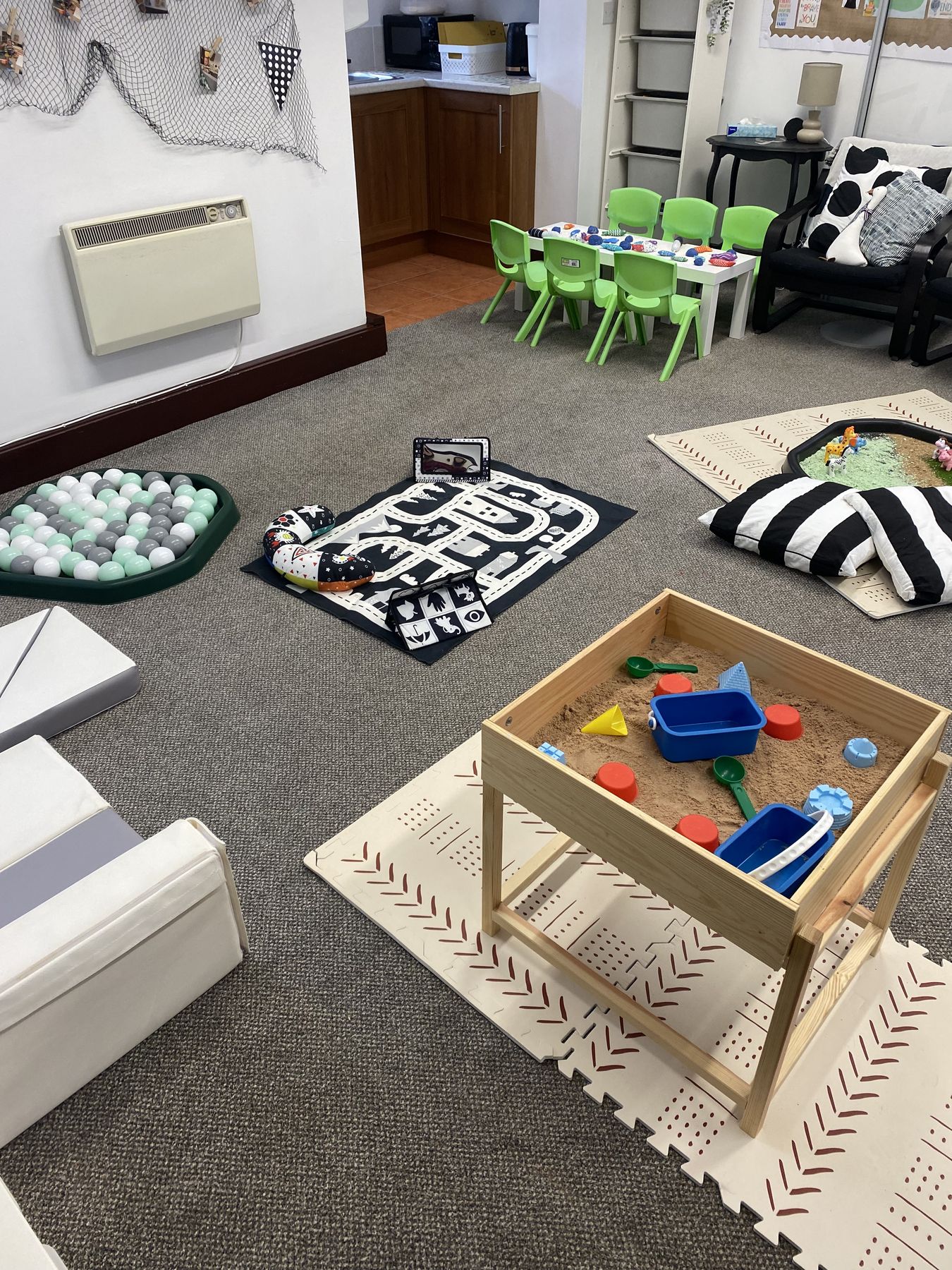 Treasure baskets and natural resources laid out for babies to explore