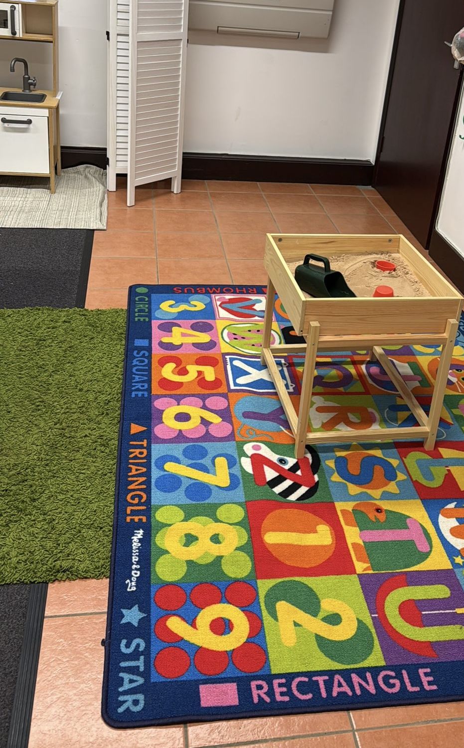 Number rug and construction tray in The Little Paddocks