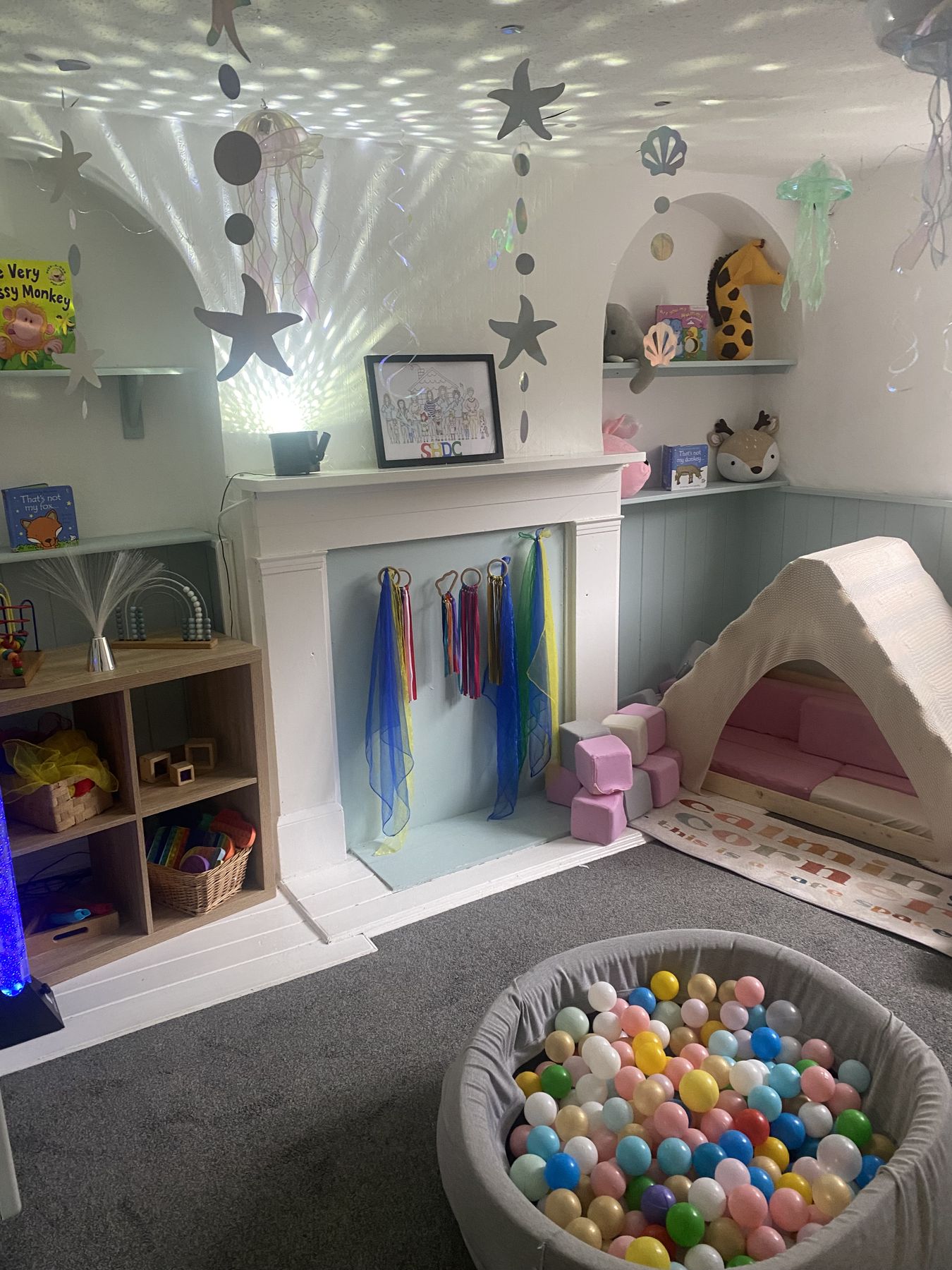 Ball pit and sensory panels in the Toddler Room