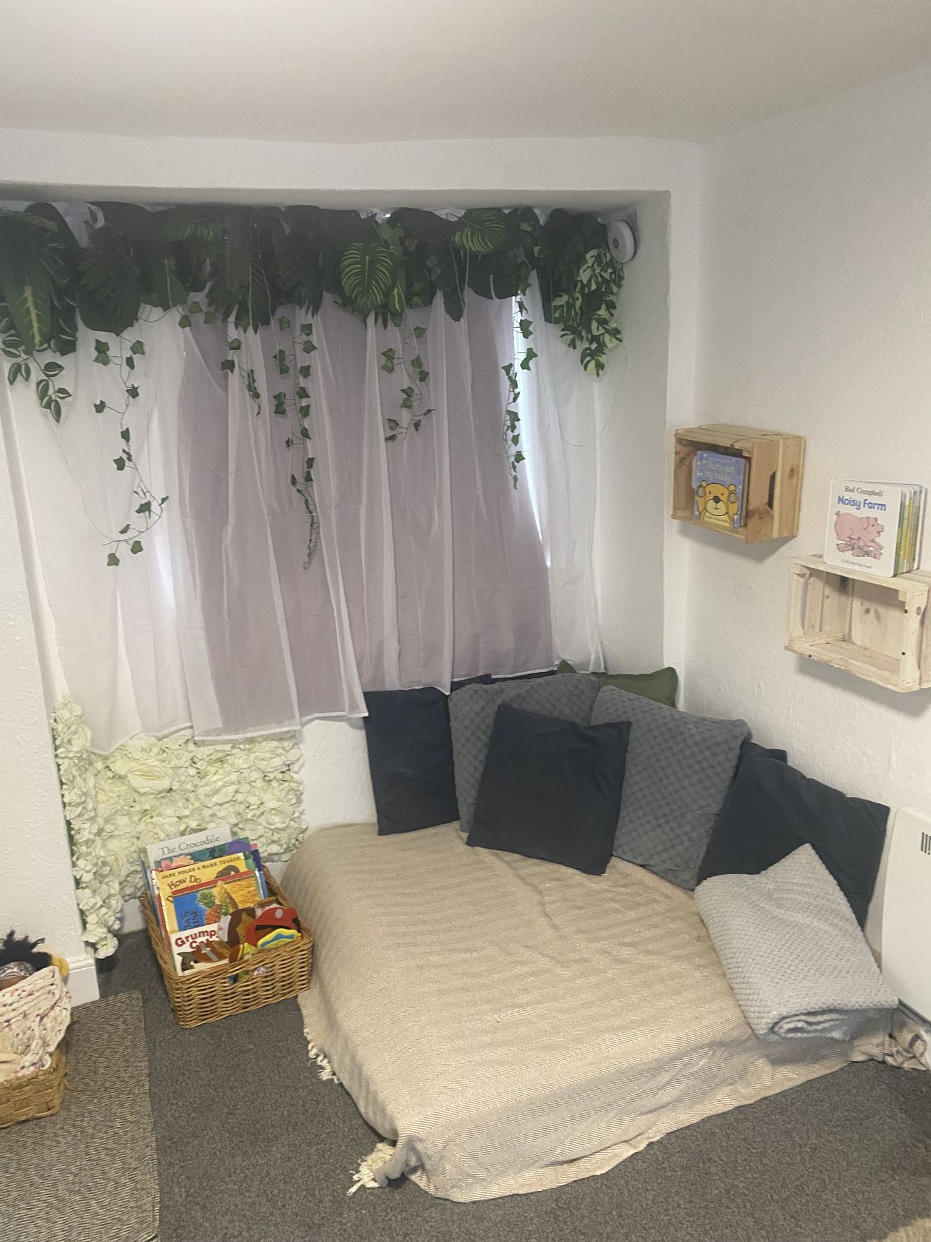Cosy cushioned corner for stories in the Toddler Room
