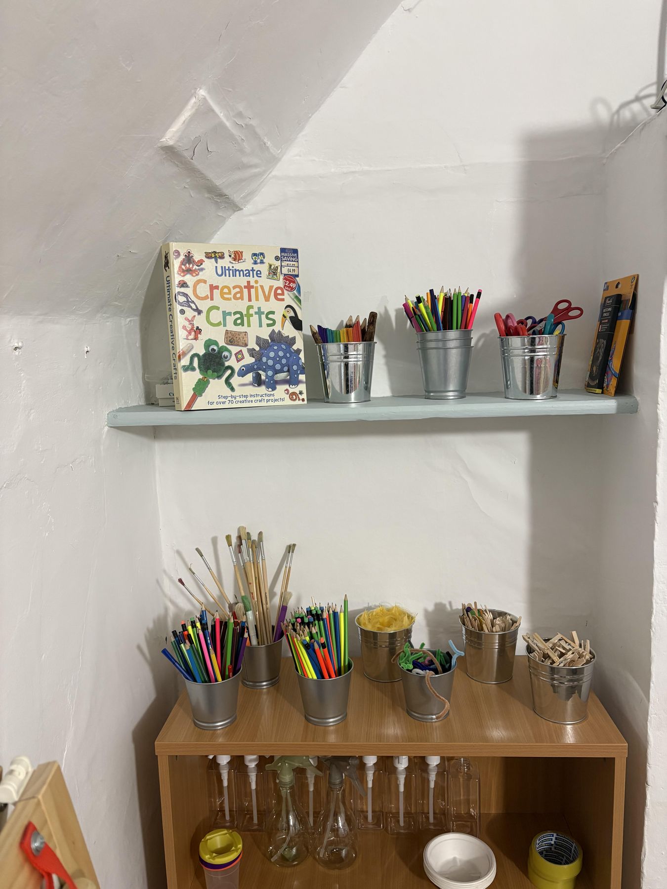 Craft station with pencils, brushes and paper pots